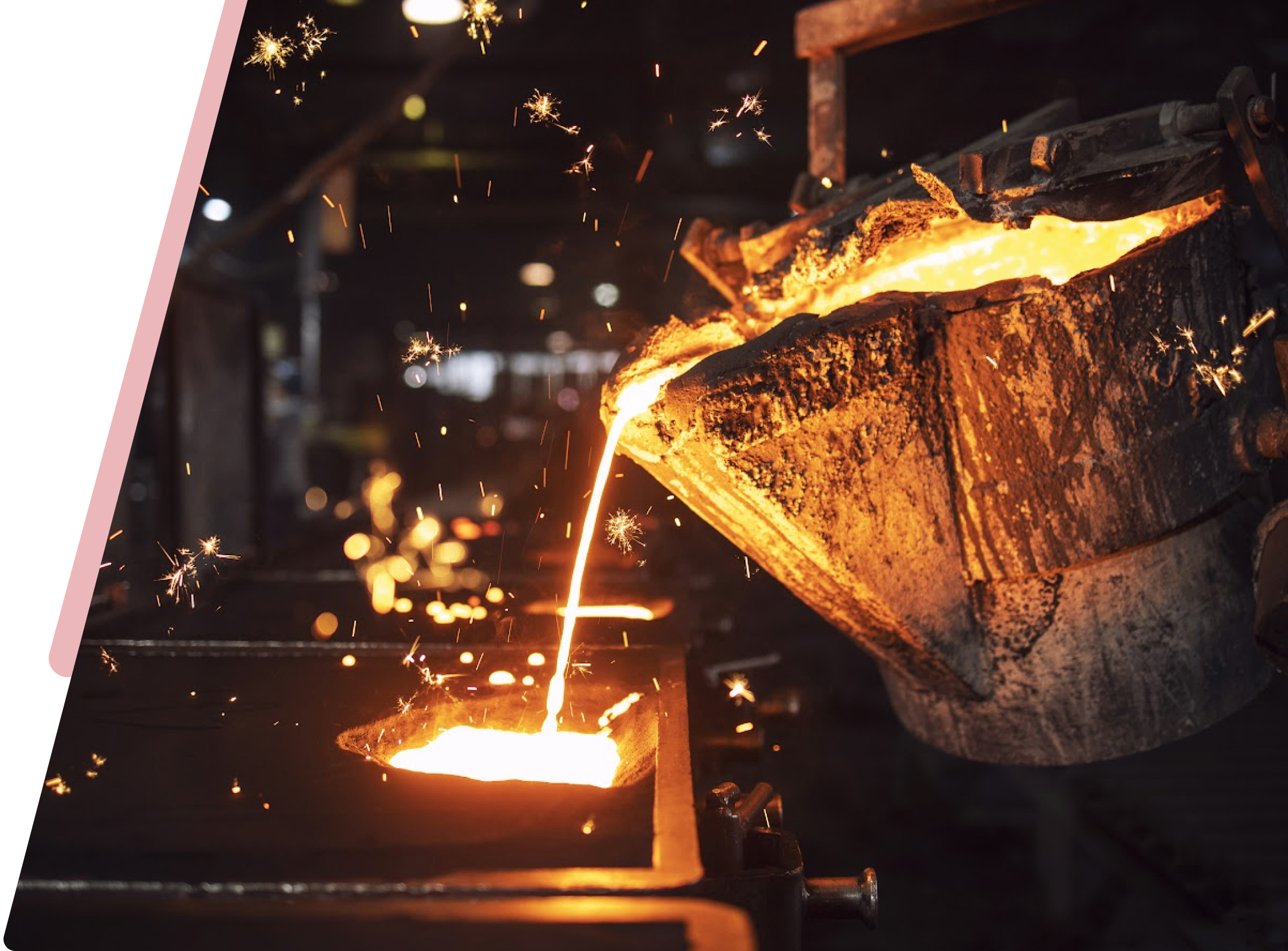 A metal casting process with hot liquid pouring out of the furnace.