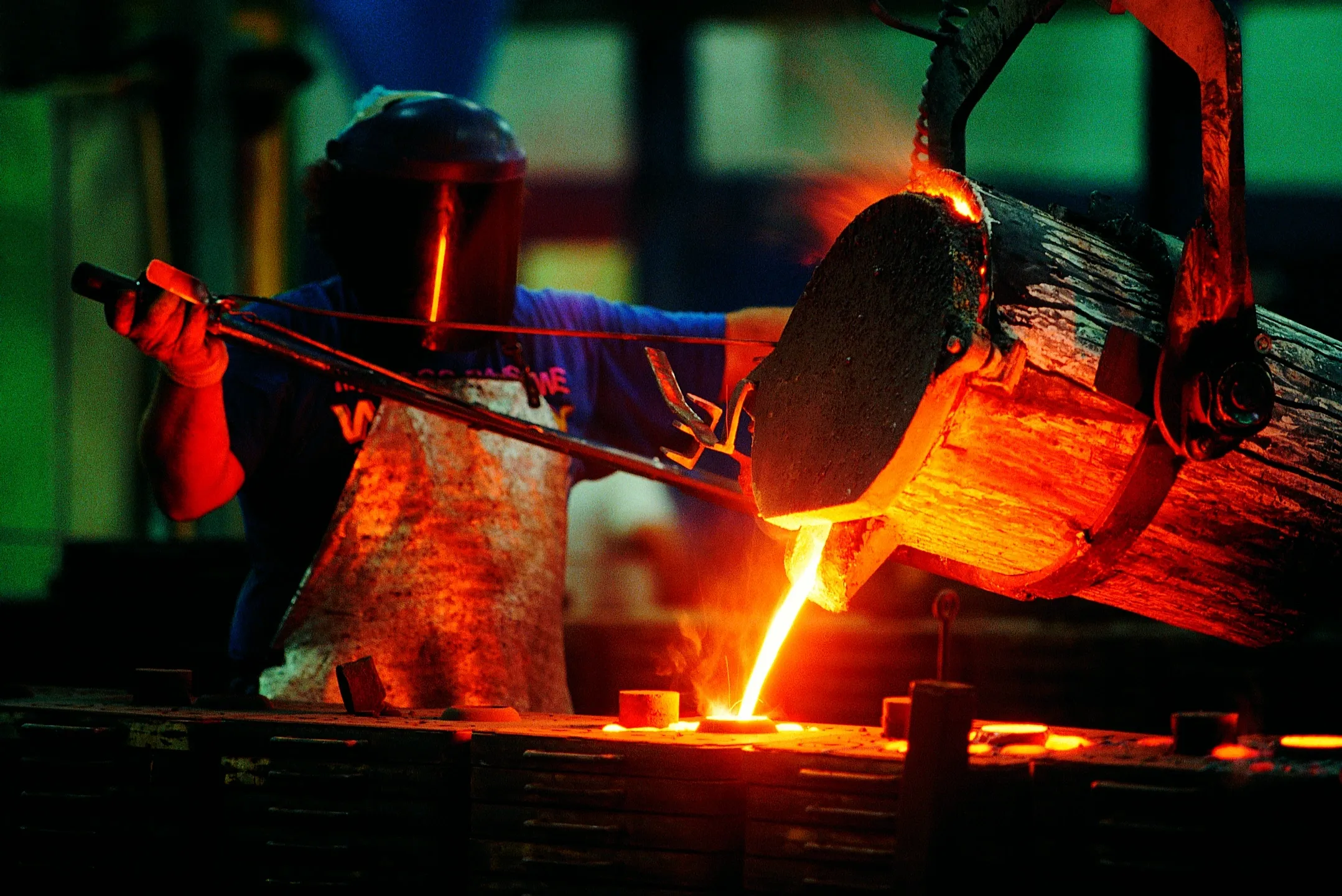67d82e955c1a1_Studio-Project (2) A person is working with metal in an industrial setting.